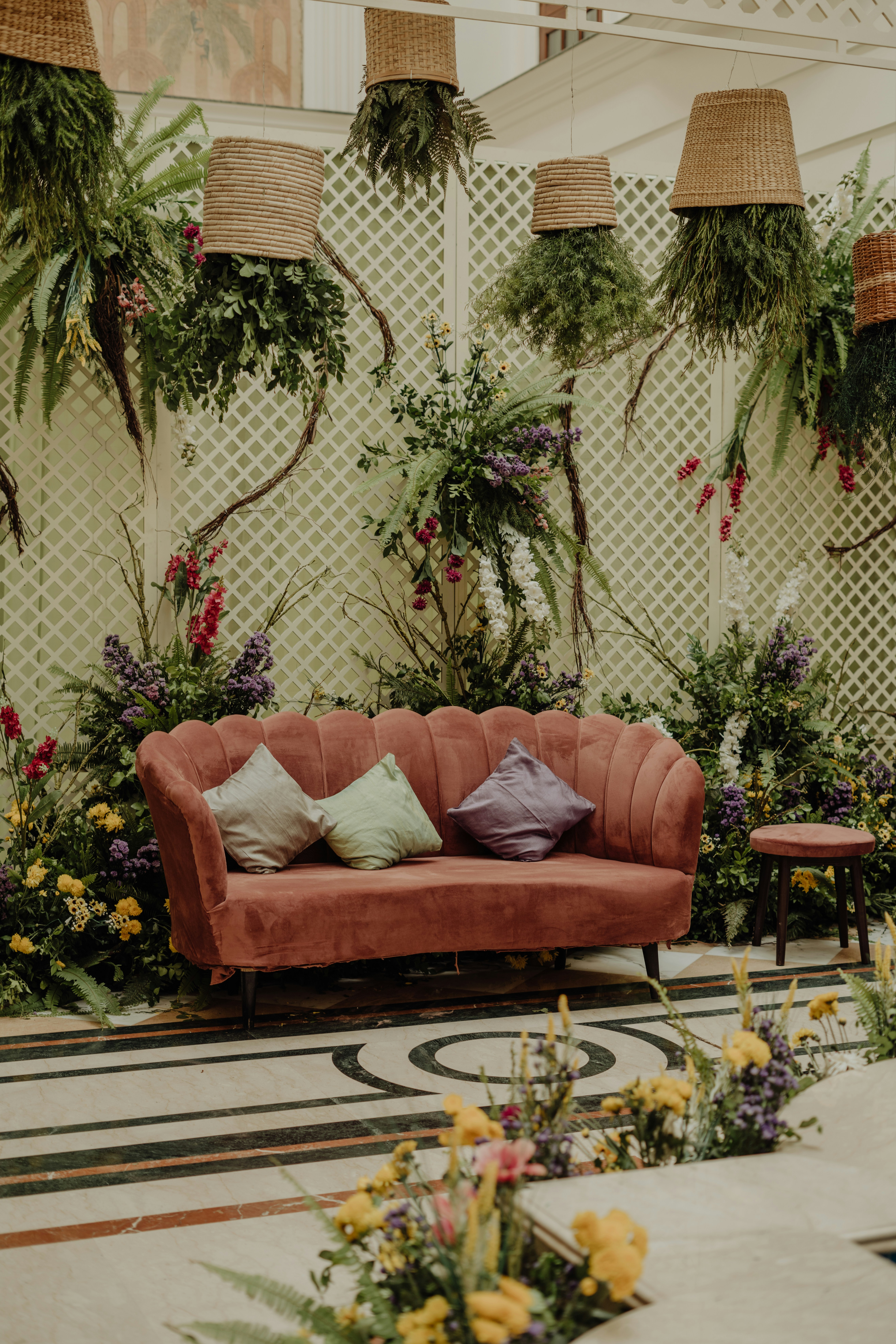 a couch and a table with flowers