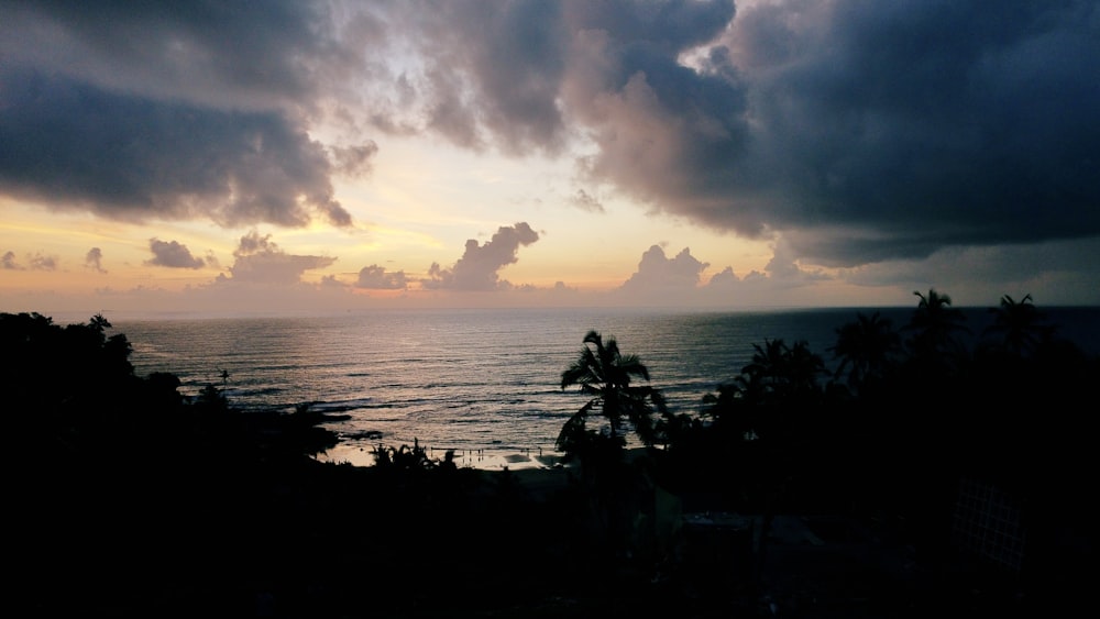 a tropical beach with a sunset