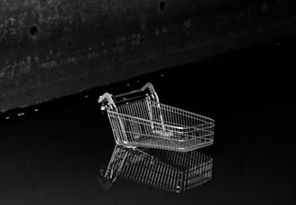a shopping cart on a black background
