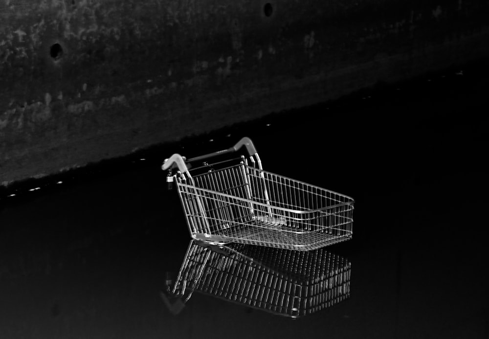 a shopping cart on a black background