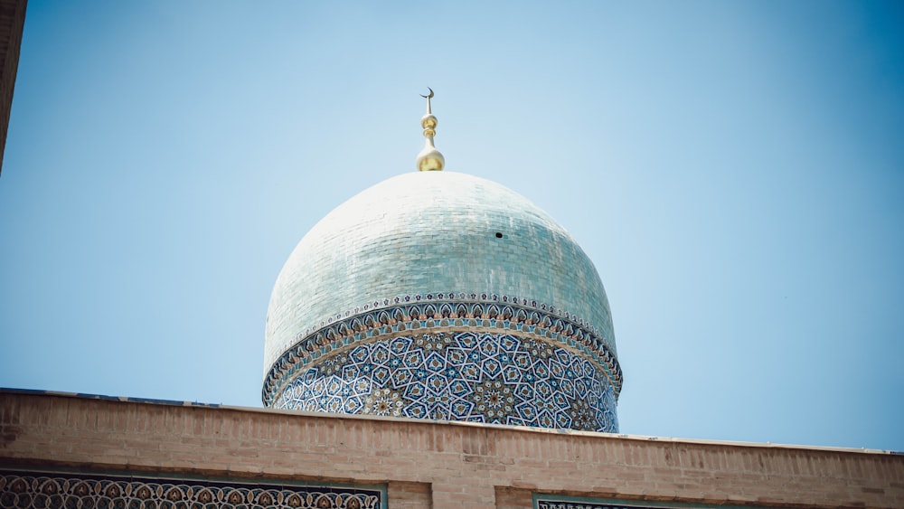 a domed building with a gold top