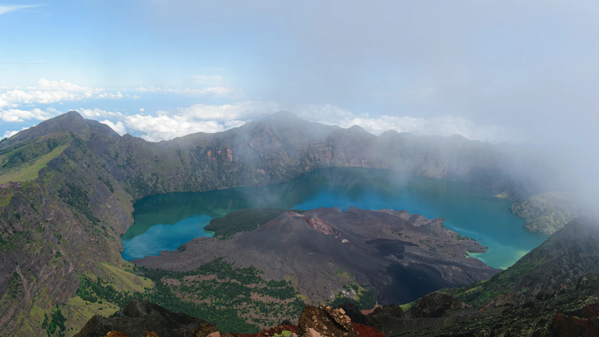 Sunrise breaking over the volcanic caldera and volcanic peak of Mount Batur