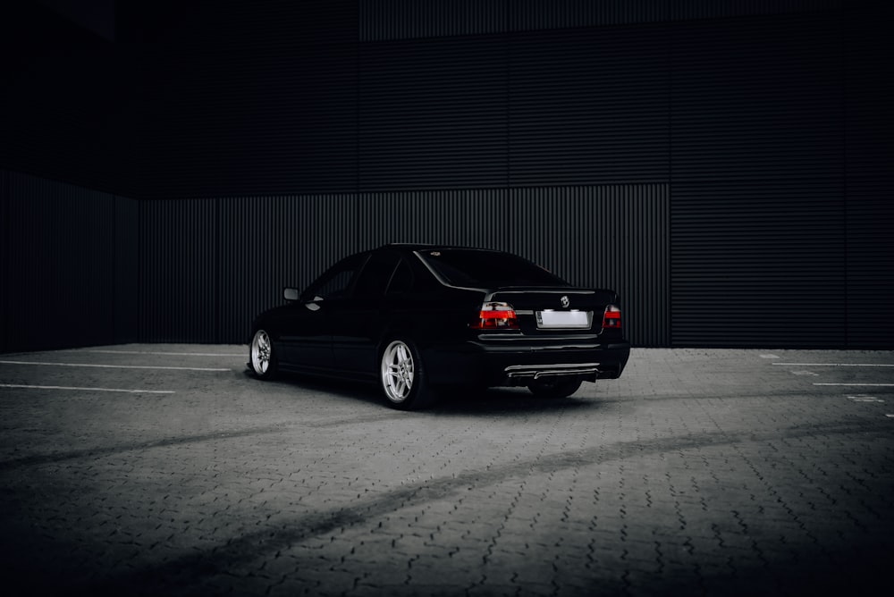 a black car parked in a parking lot