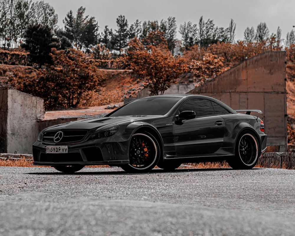 a black car parked on a road