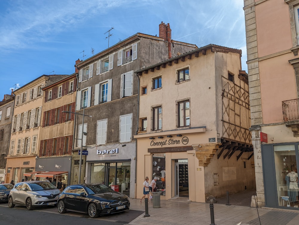 a street with cars and buildings along it