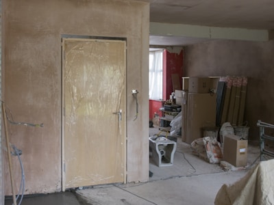 a room with a door and boxes