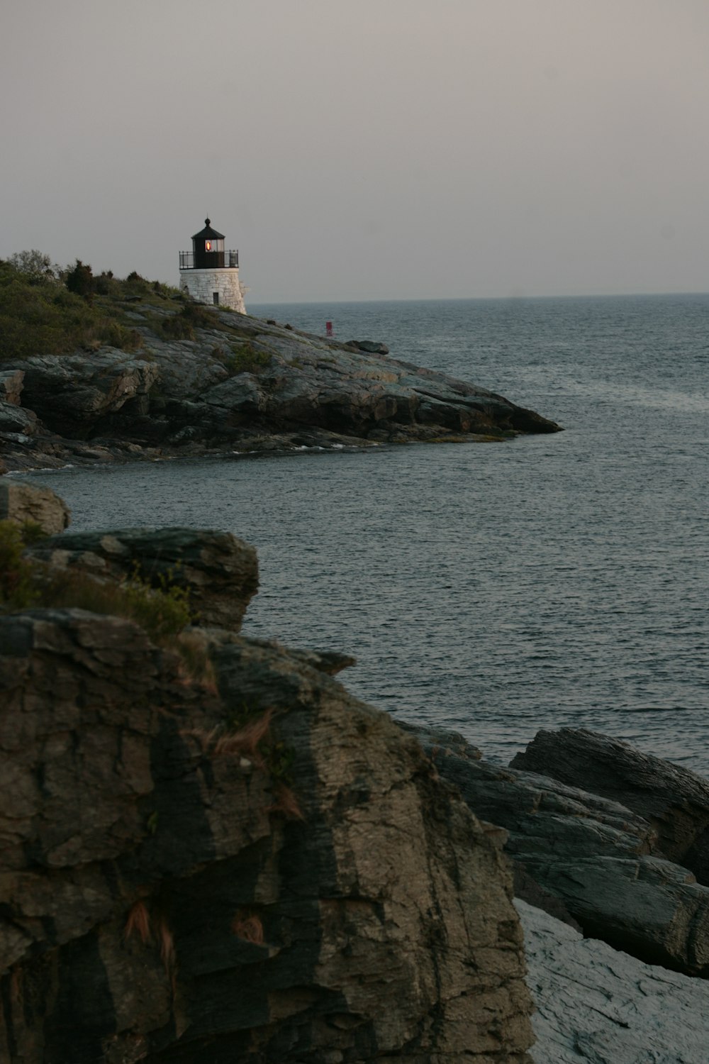 a lighthouse on a rocky cliff