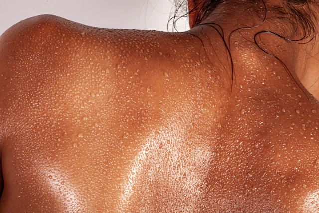 Spray tan treatment in a UK tanning studio