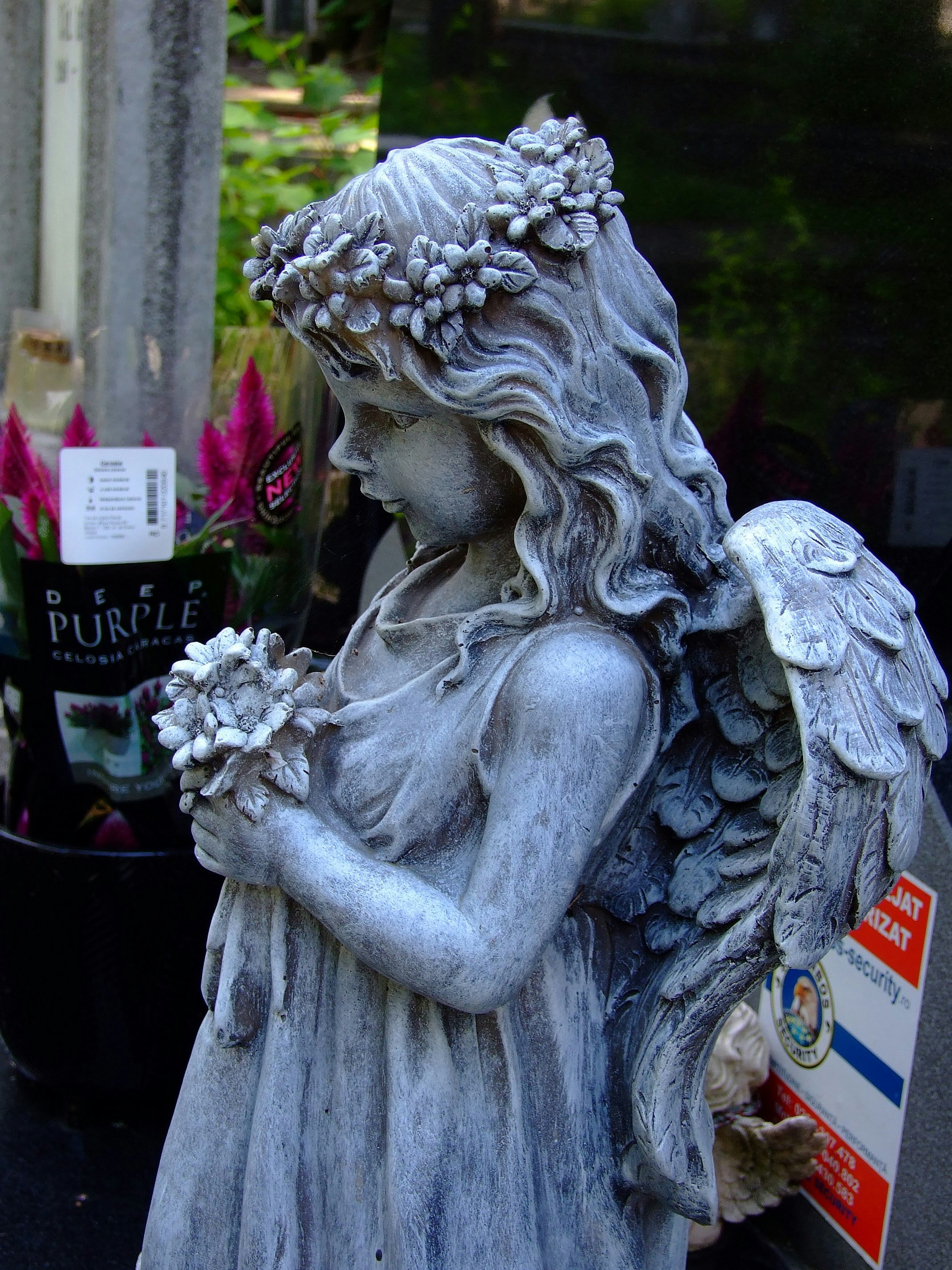 a statue of a person holding flowers