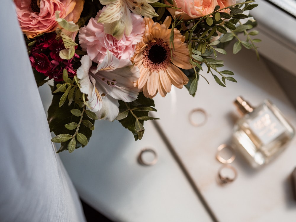 a bouquet of flowers in a vase on a table