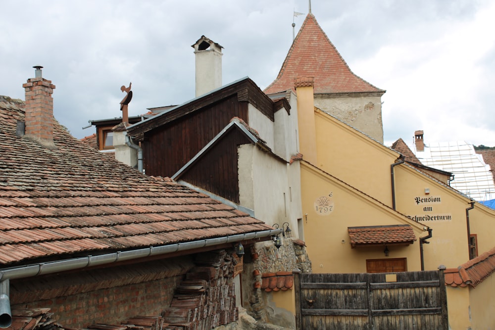 a group of buildings with a red roof