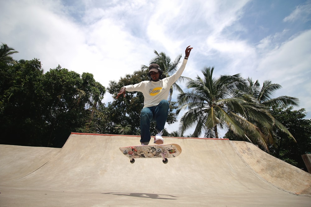 a man riding a skateboard at a skatepark