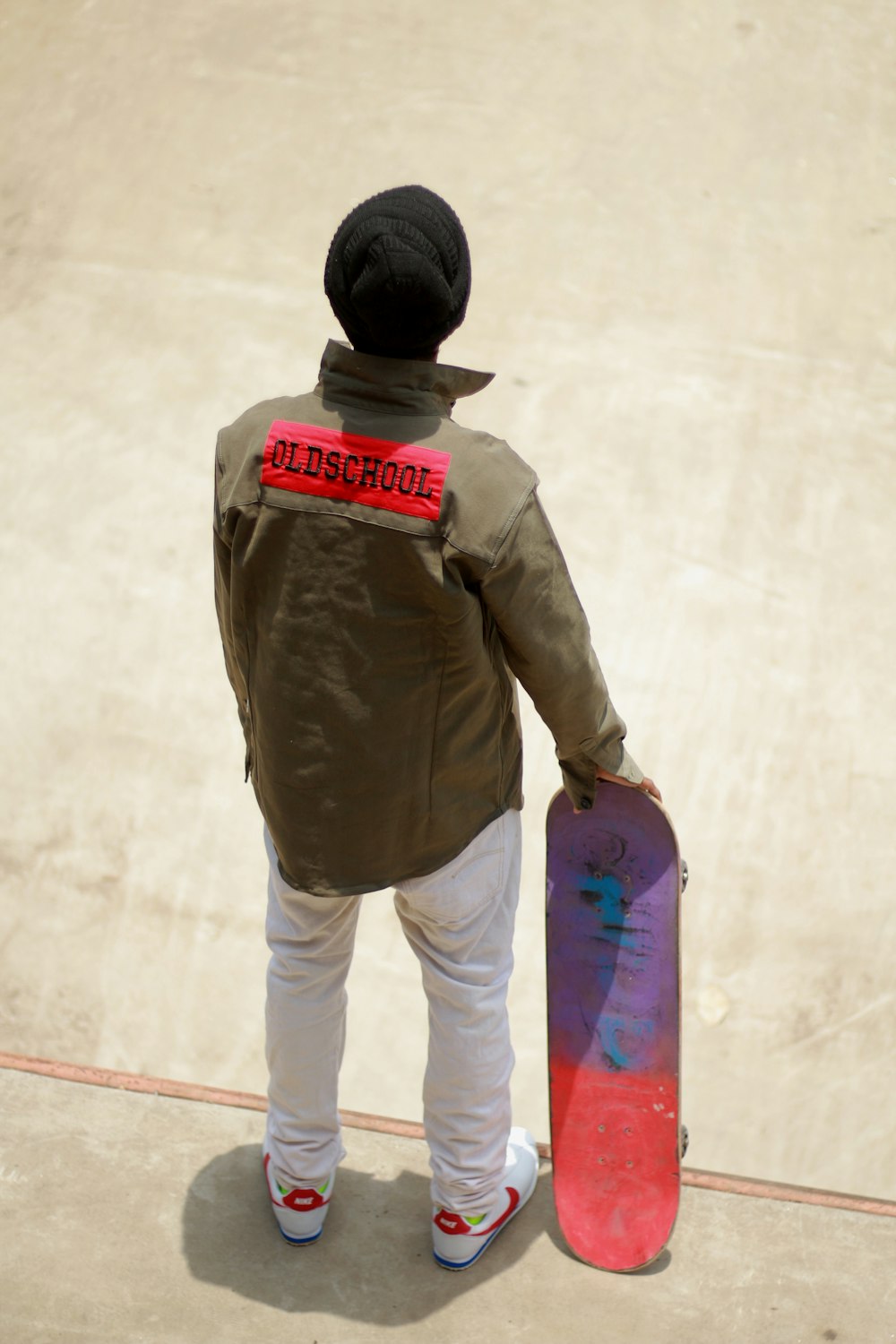 a kid holding a skateboard