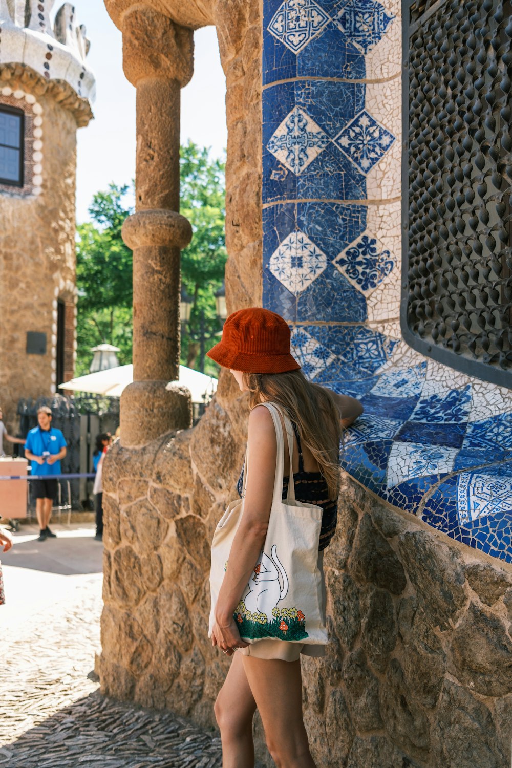 a person standing next to a wall