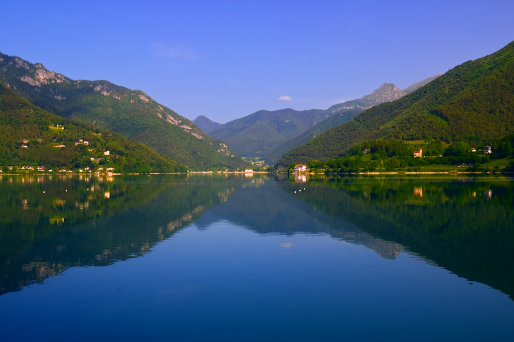 a lake with mountains in the background