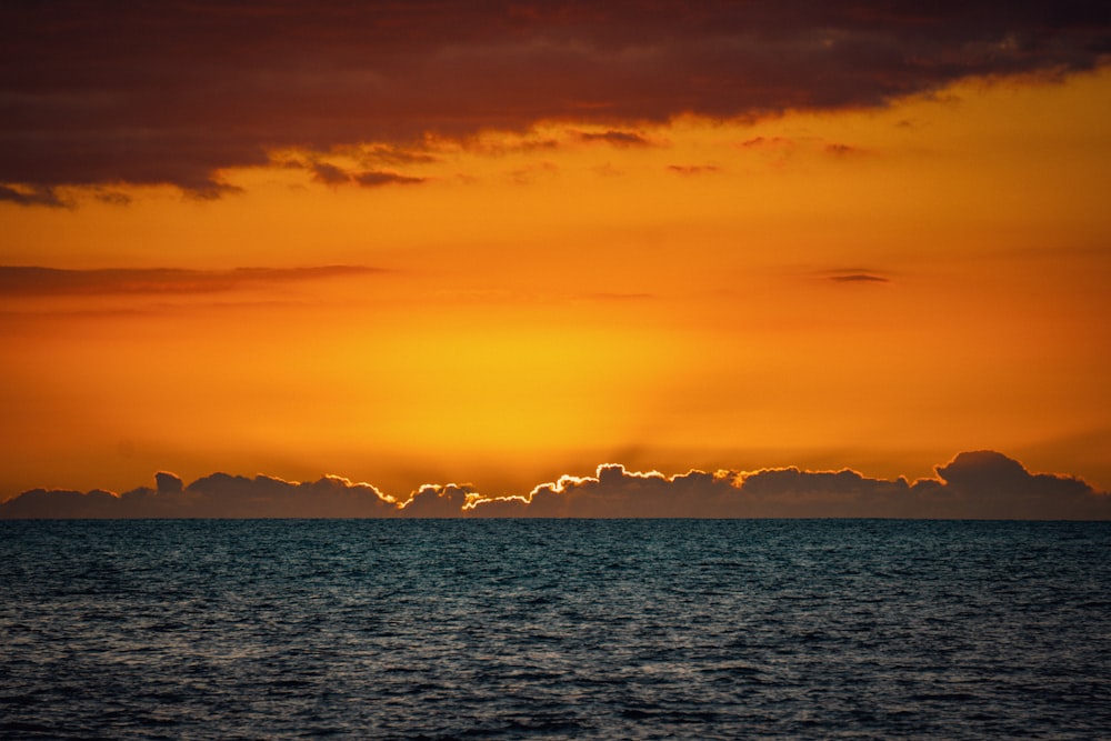 a body of water with a sunset