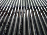 Rows of metal components lined up after fabrication, showcasing uniform quality.