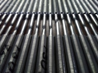 Rows of polished tantalum pieces ready for assembly.