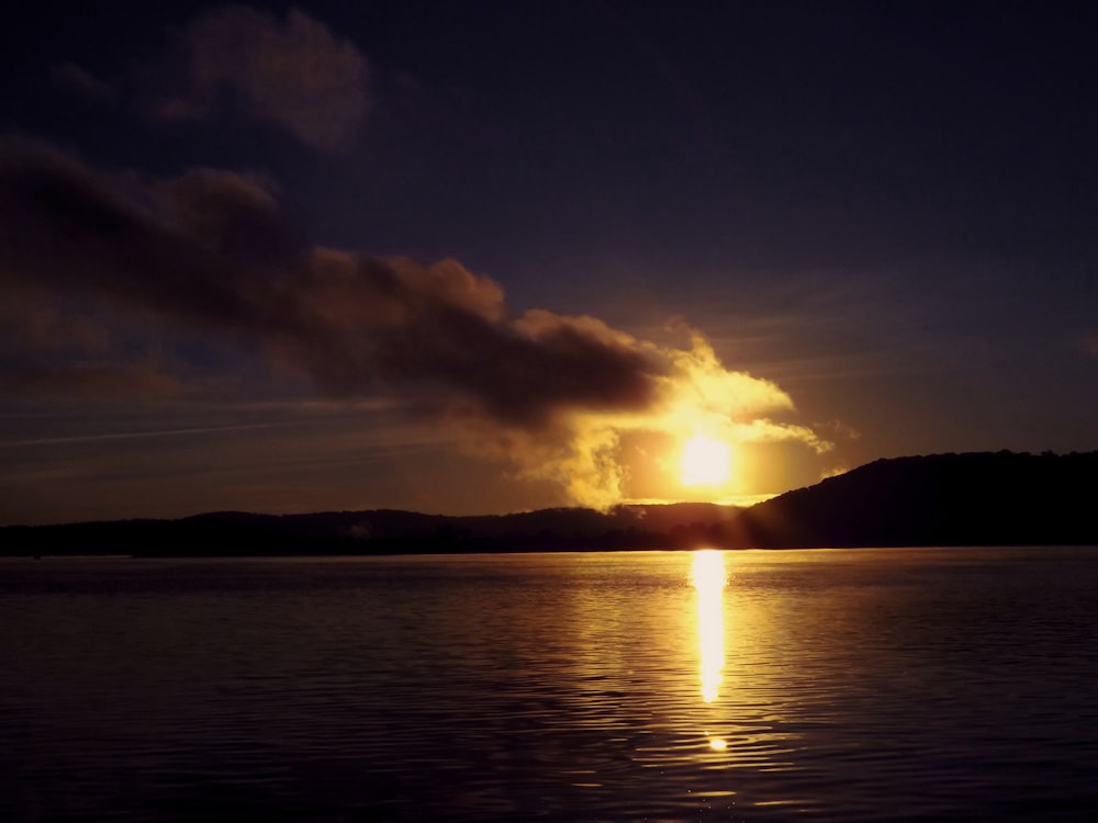 a sunset over a body of water