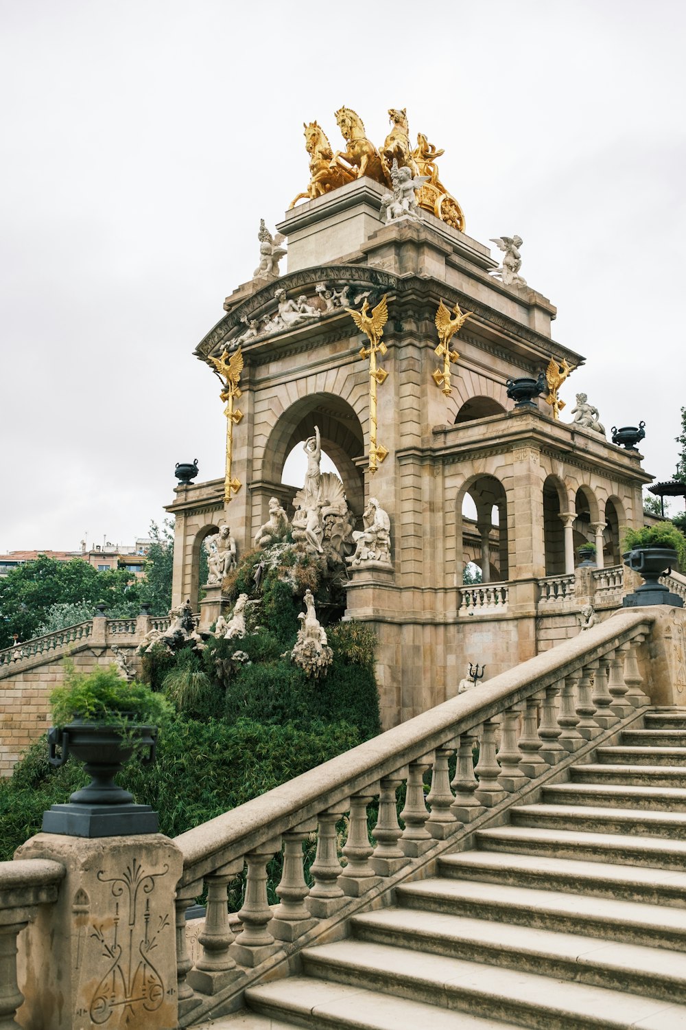 a building with stairs and statues