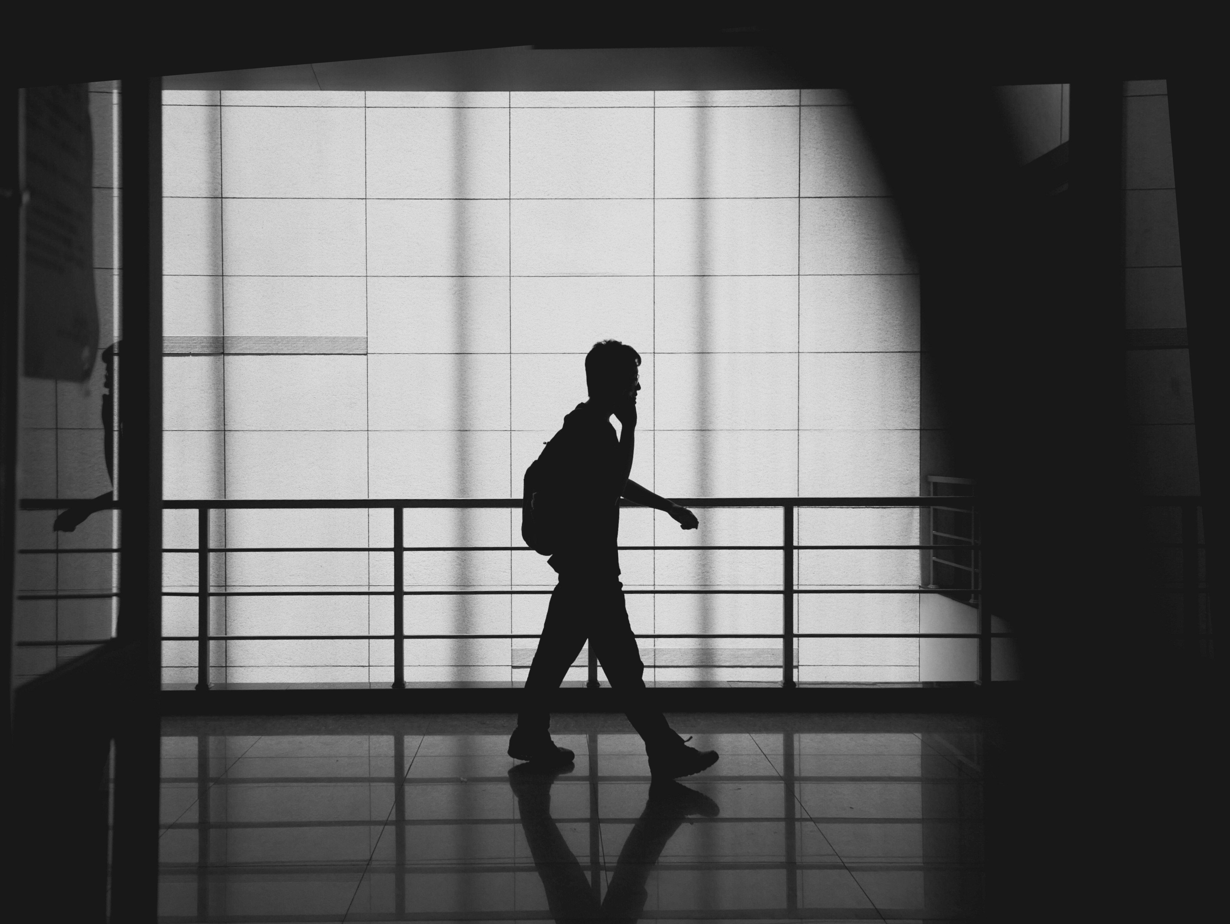 a person walking in a dark room