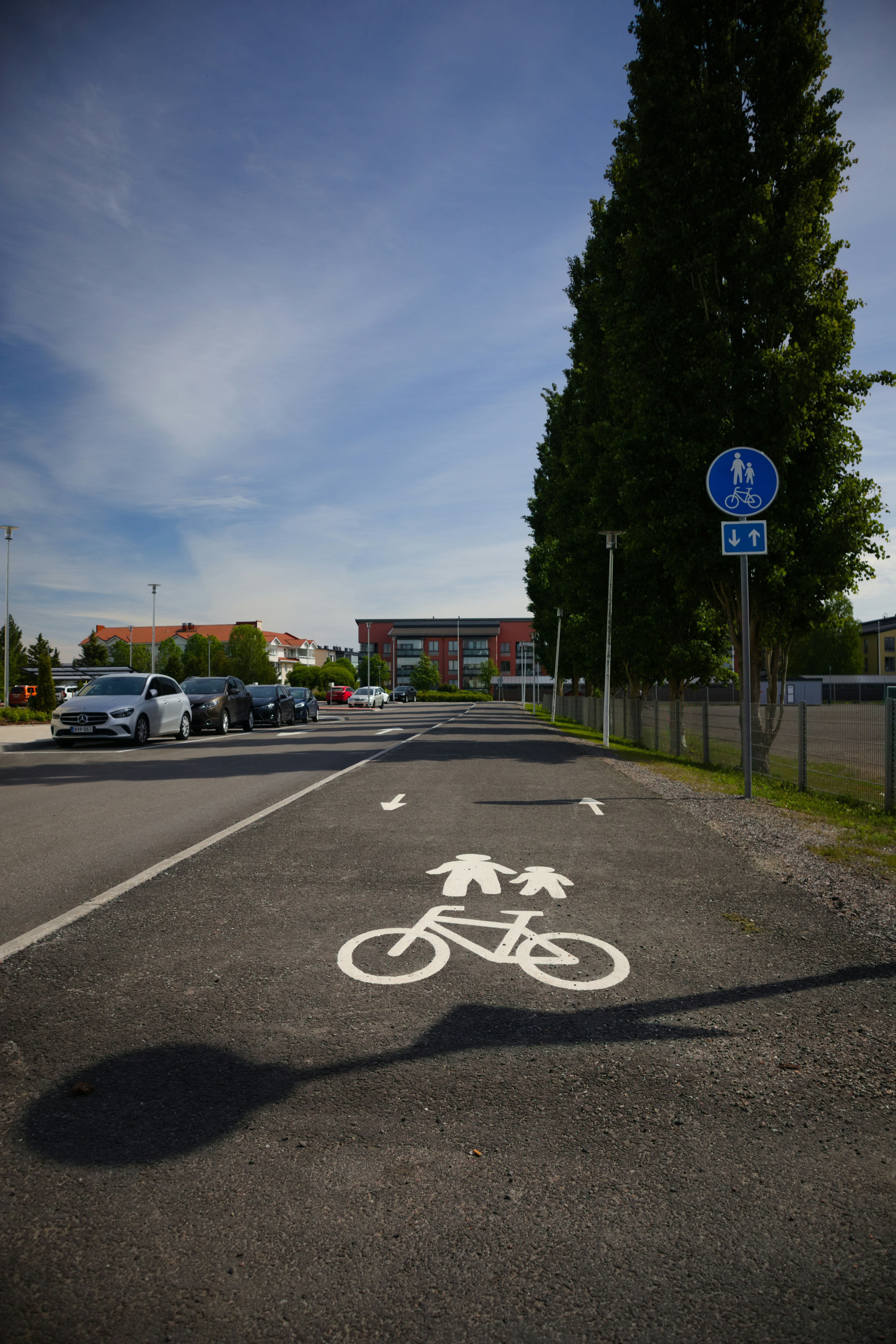 a bicycle lane sign on a road