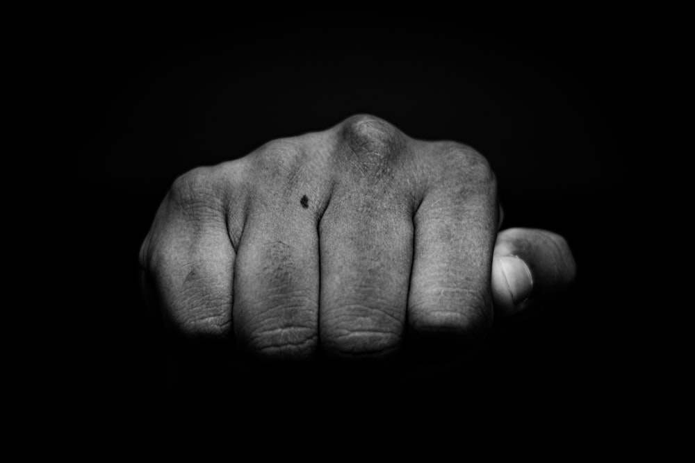 a hand with a black background