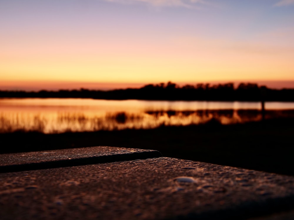 a road next to a body of water