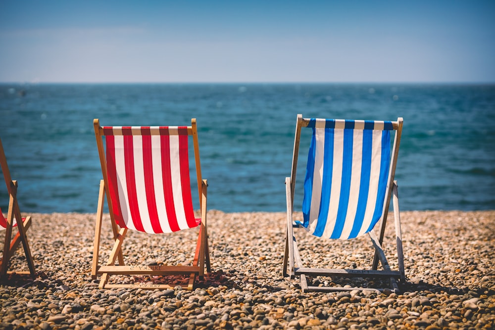 a group of chairs on a beach