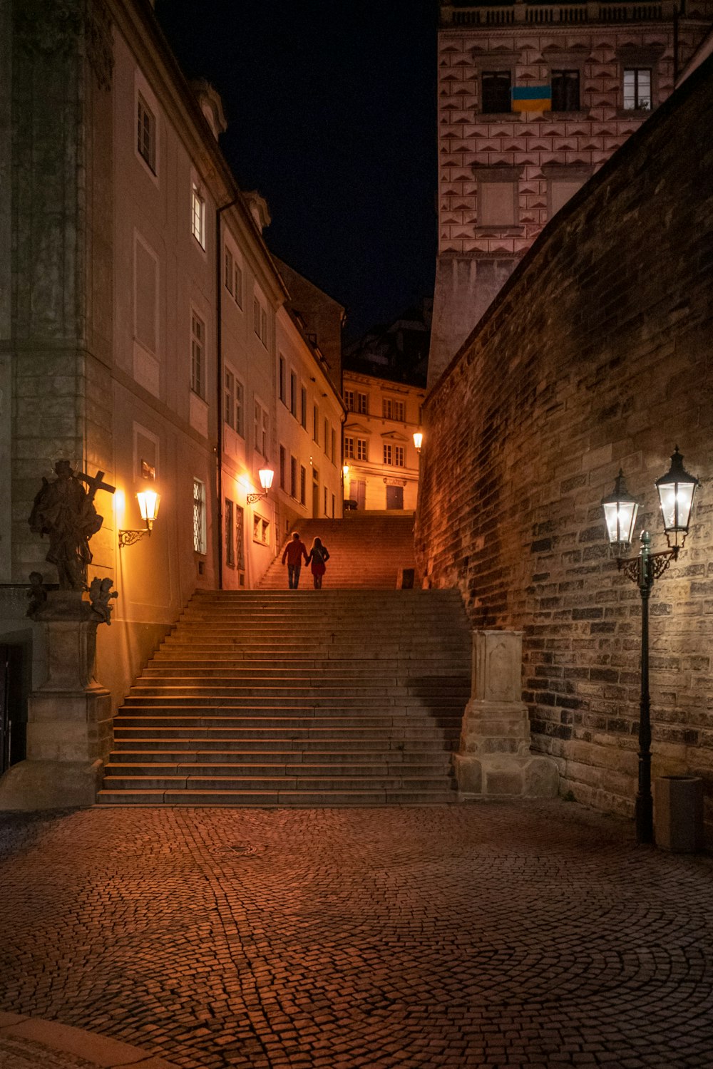 a stone walkway between two buildings