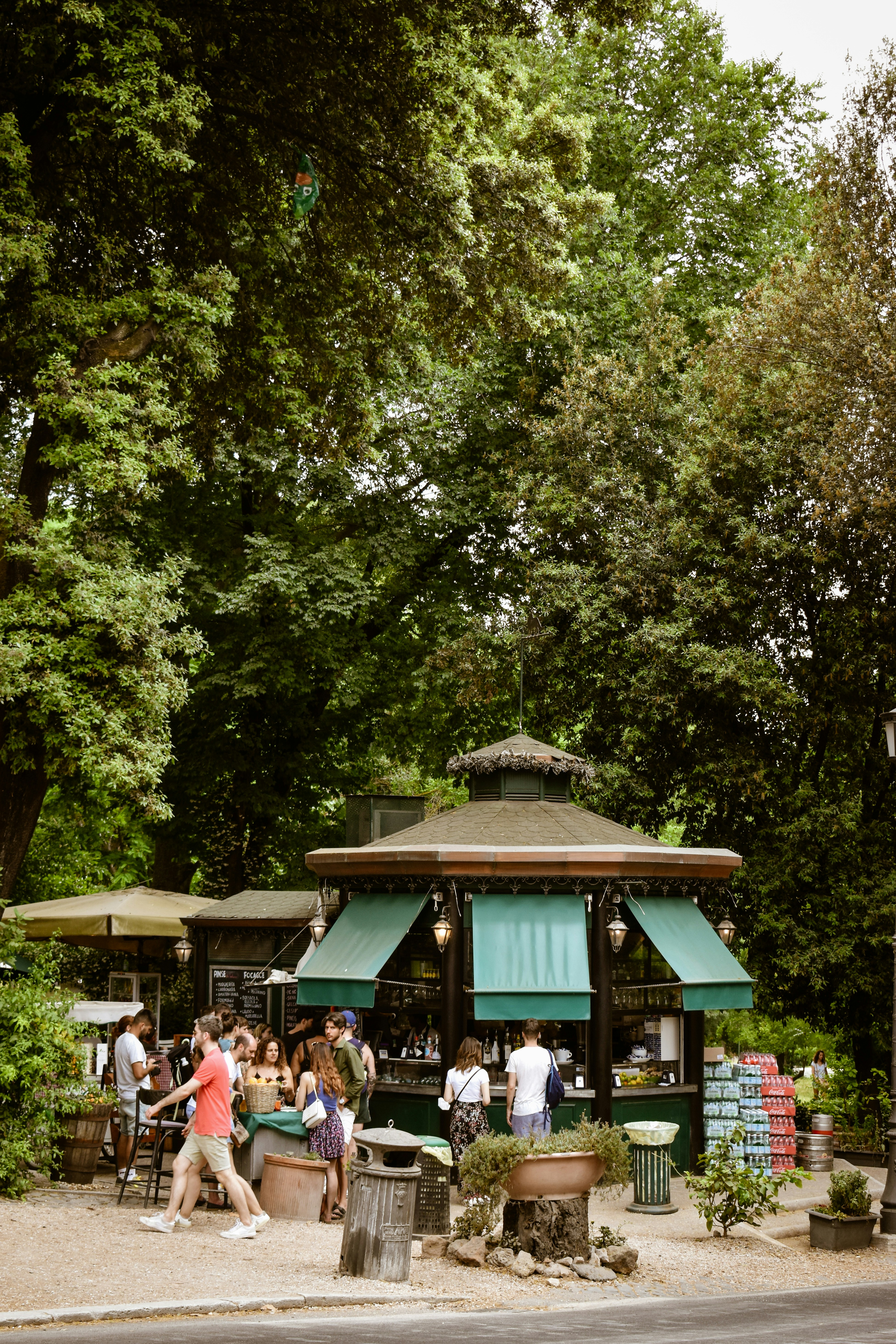a group of people outside a small building