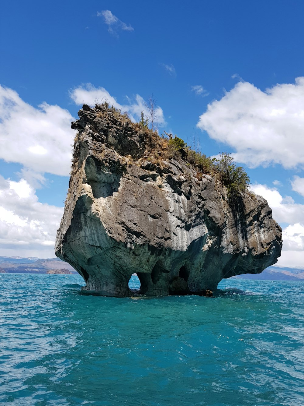 a large rock formation in the water