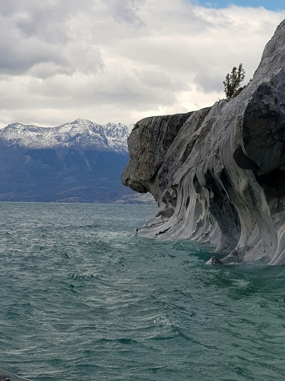 a large rock in the water