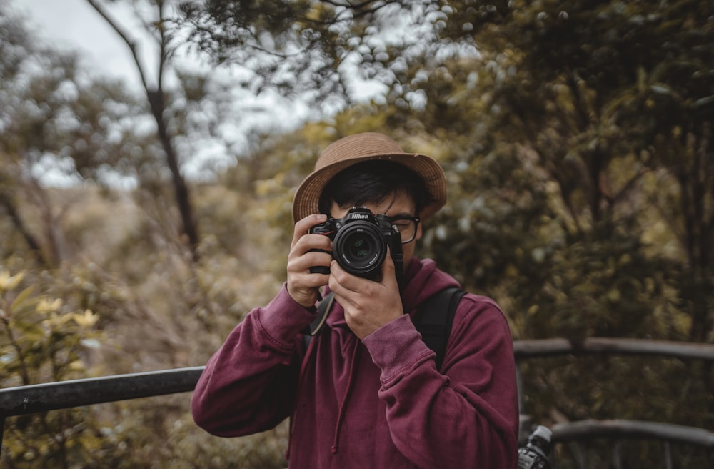 a person holding a camera