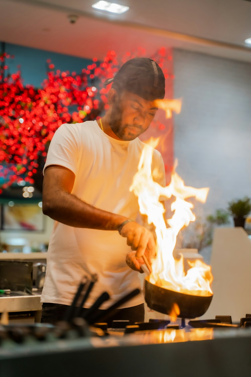 a man cooking food in a kitchen