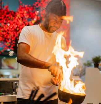 a man cooking food in a kitchen