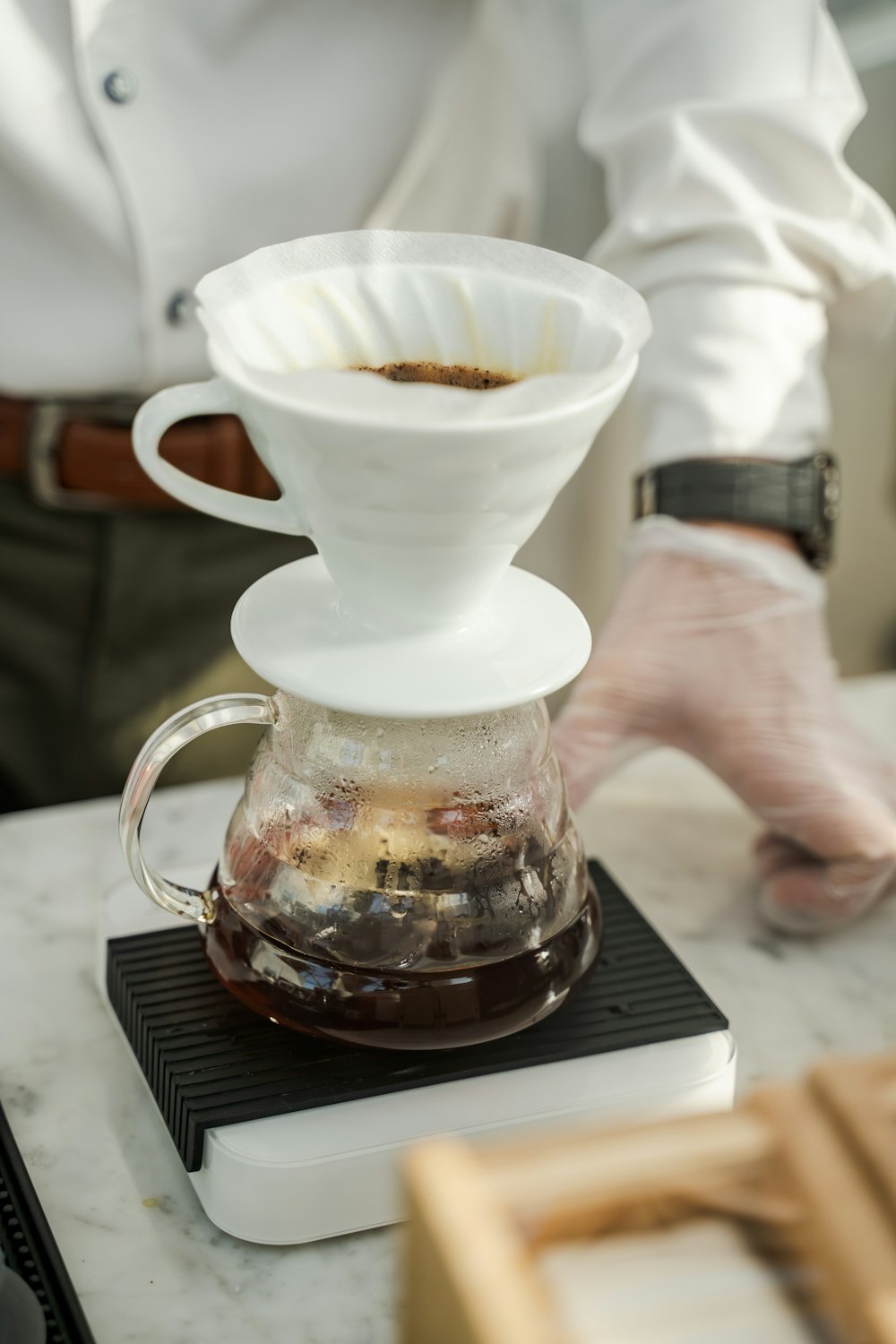 a person holding a coffee cup