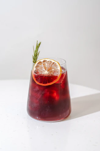 a glass with a drink in it