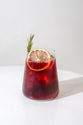 a glass with a drink in it