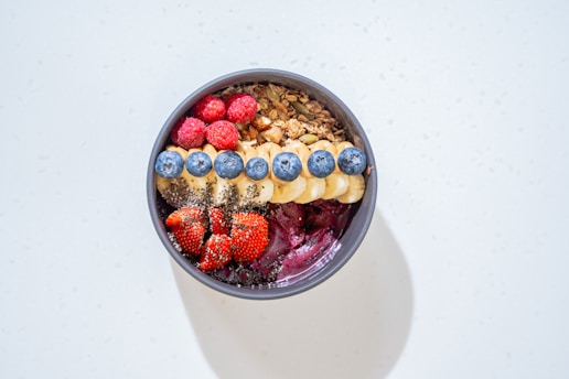 a bowl of cereal with milk and fruit