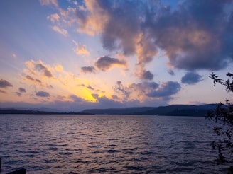 A scenic view of Lake Toba at sunset.