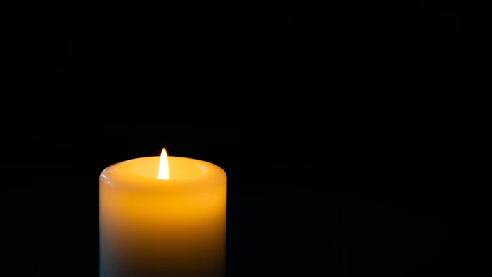 A single candle burning in remembrance