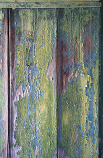 A detailed shot of a wood panel painting with subtle color fades and textured layers reminiscent of street art.