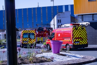 a group of emergency vehicles parked outside a building
