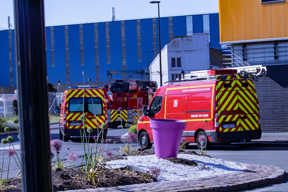 a group of emergency vehicles parked outside a building