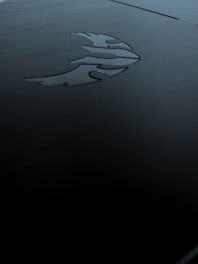 A sleek dark mode interface with gold and silver accents illustrating digital and spiritual evolution.