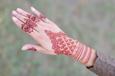 a person's hand with a tattoo on it