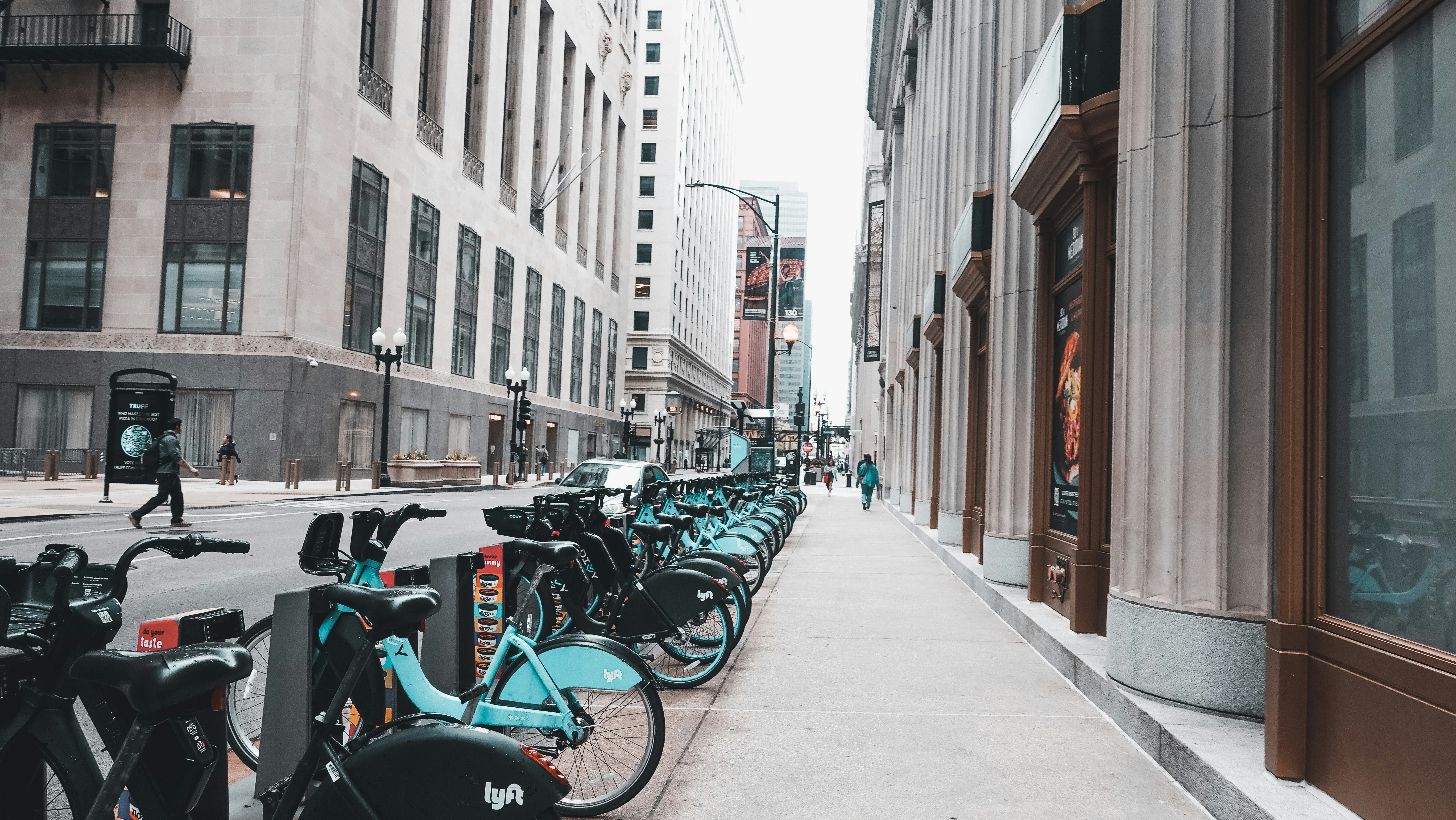 a group of bicycles parked on the side of a street