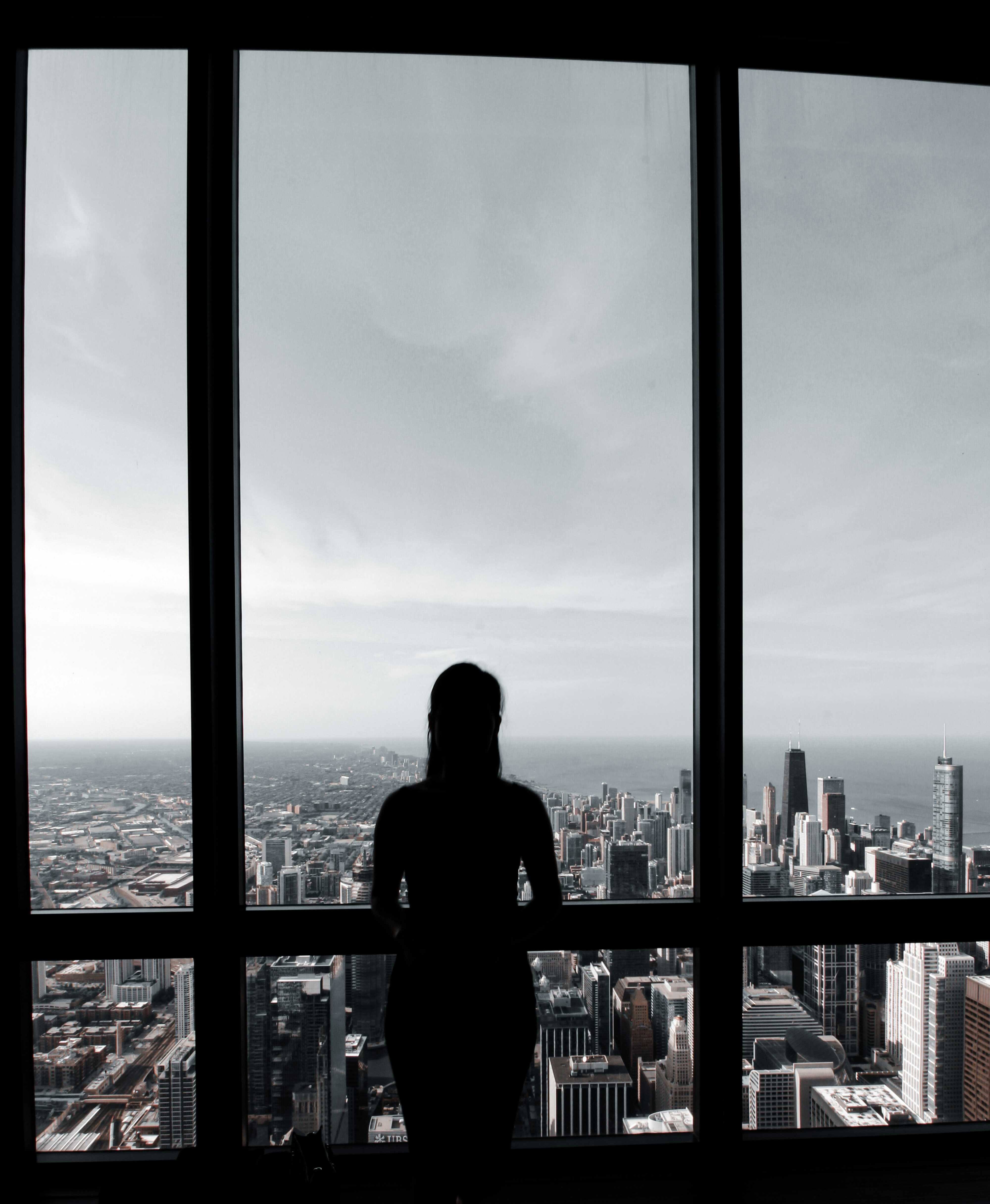 a person looking out a window