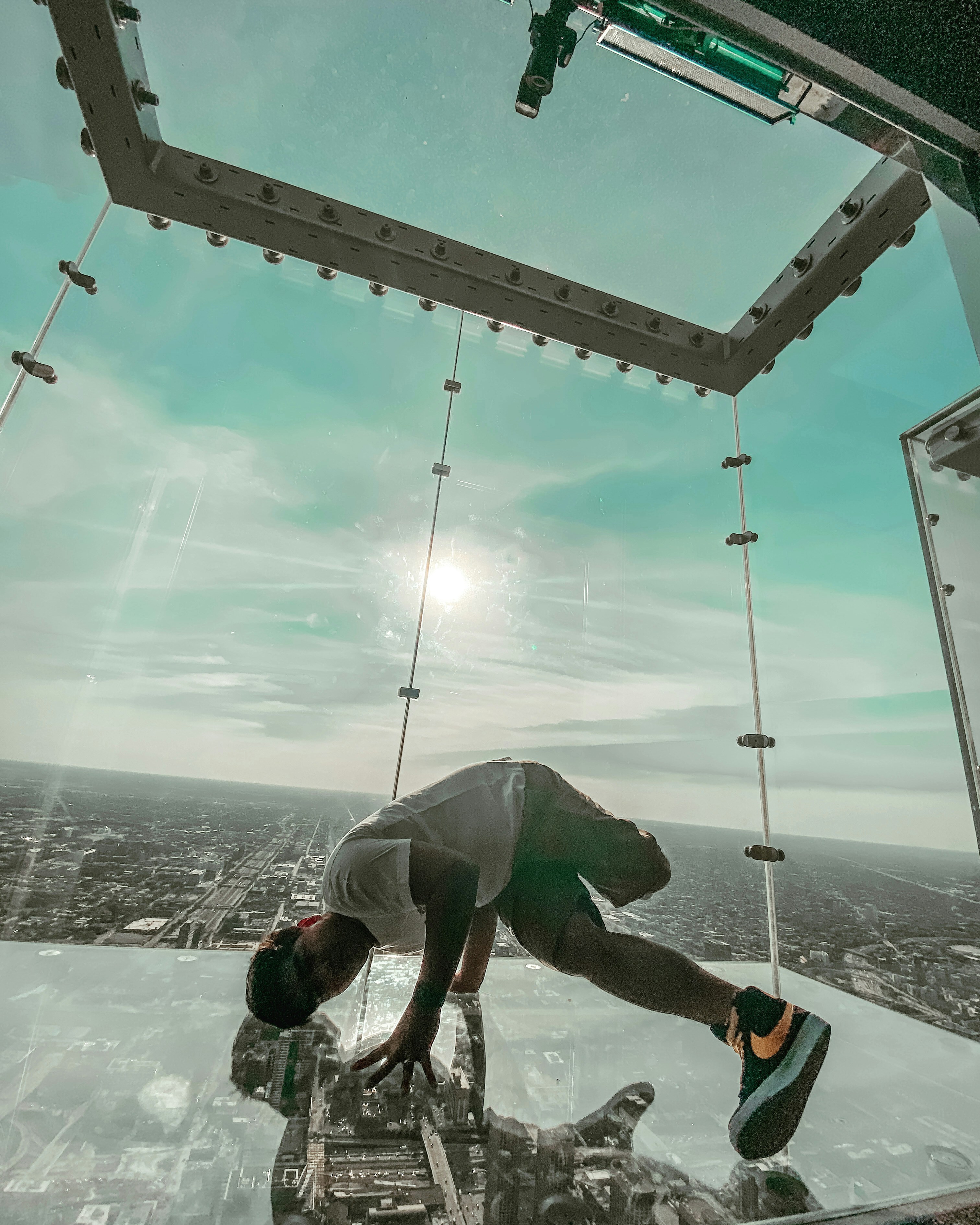 a man doing a flip on a ski lift